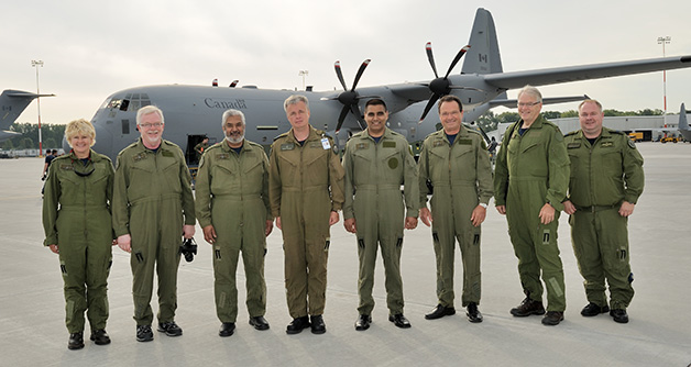 Cheryl Gallant, MP with Members of the Standing Committee on National Defence, standing in front of a RCAF CC-177 Globemaster III Transport Aircraft. The CC-177 is delivering Canada's contribution to the effort in West Africa