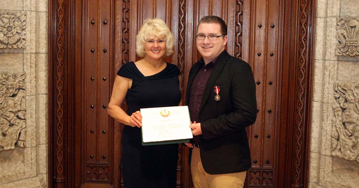 Cheryl Gallant Presents Dustin Garron With Diamond Jubilee Medal